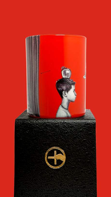 Red scented candle with 'The Opera is Burning' text and proprietary Créateur Olfactif illustrations on a red background